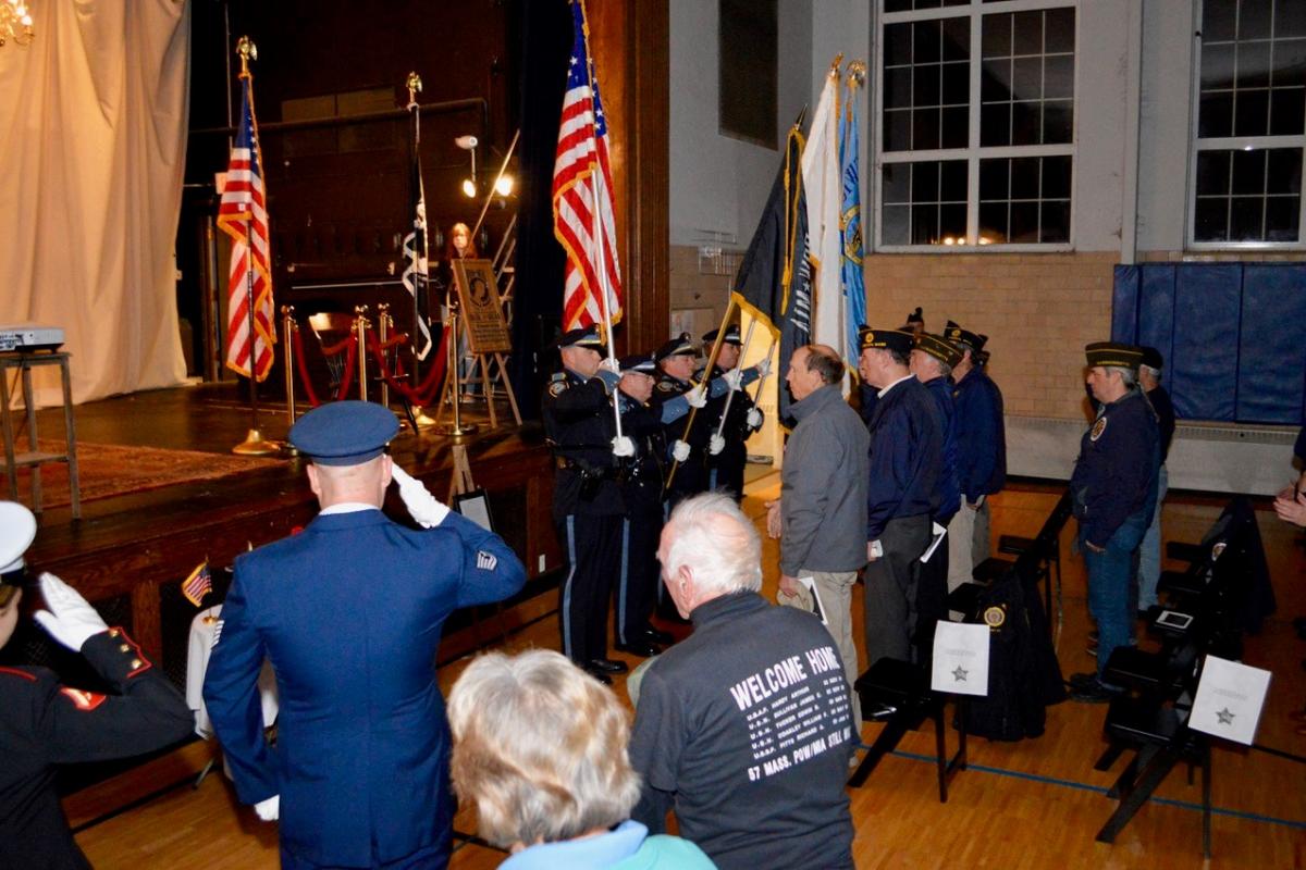 POW/MIA Chair of Honor Ceremony at Ipswich Town Hall - Ipswich Police Honor Guard marching to the front of the stage