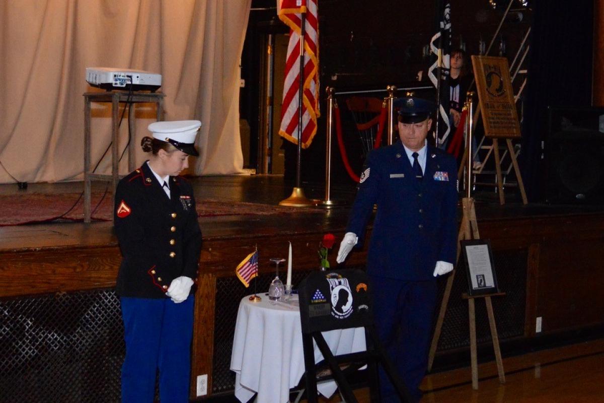 POW/MIA Chair of Honor Ceremony at Ipswich Town Hall - Veterans pointing out items on the table while a script is read